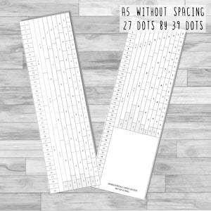 May include: A black and white grid with 27 dots by 39 dots. The grid is labeled "A5 Without Spacing" and "27 Dots by 39 Dots". The grid is on a wood background.