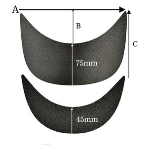 Puede incluir: Dos parches de tela negra con bordes curvos. El parche más grande mide 75 mm de alto y el parche más pequeño mide 45 mm de alto.