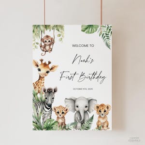 May include: A white poster with watercolor illustrations of jungle animals, including a giraffe, zebra, elephant, lion, cheetah, and monkey. Text reads "Welcome to Noah's First Birthday, October 5th, 2025."