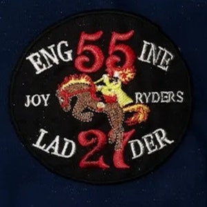 May include: Black and white embroidered patch with red and yellow accents. The patch reads "ENG 55 INE JOY RYDERS LAD 21 DER".