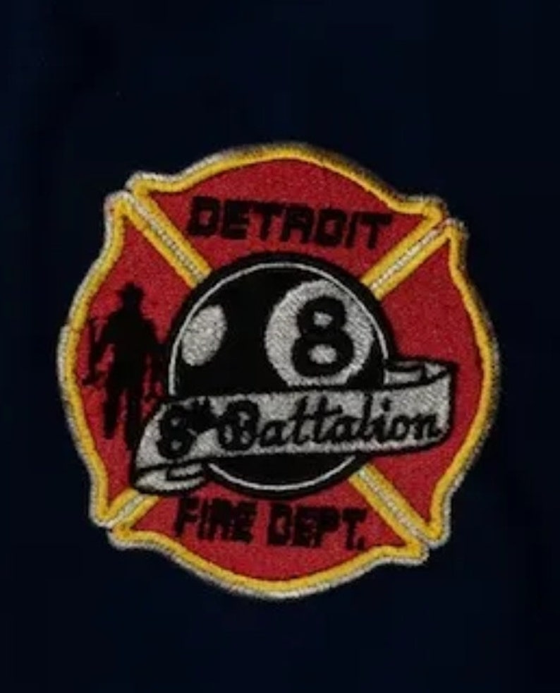 May include: Red and yellow embroidered patch with a black 8-ball and the text "Detroit 8 Battalion Fire Dept."