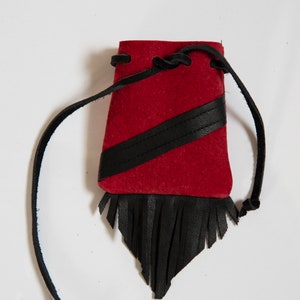 Pouch made of genuine leather. Leather drawstring and fringe.