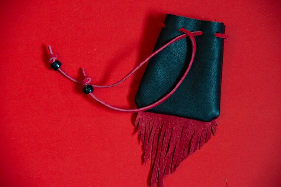 Black with red on the inside no scratches and a soft leather pouch Amazon.com: Large velvet drawstring pouch, red velvet lining  main image 3