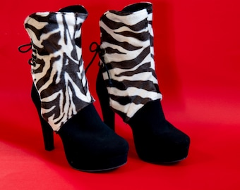 Zebra print boot covers. Short faux fur in a brown and cream color.