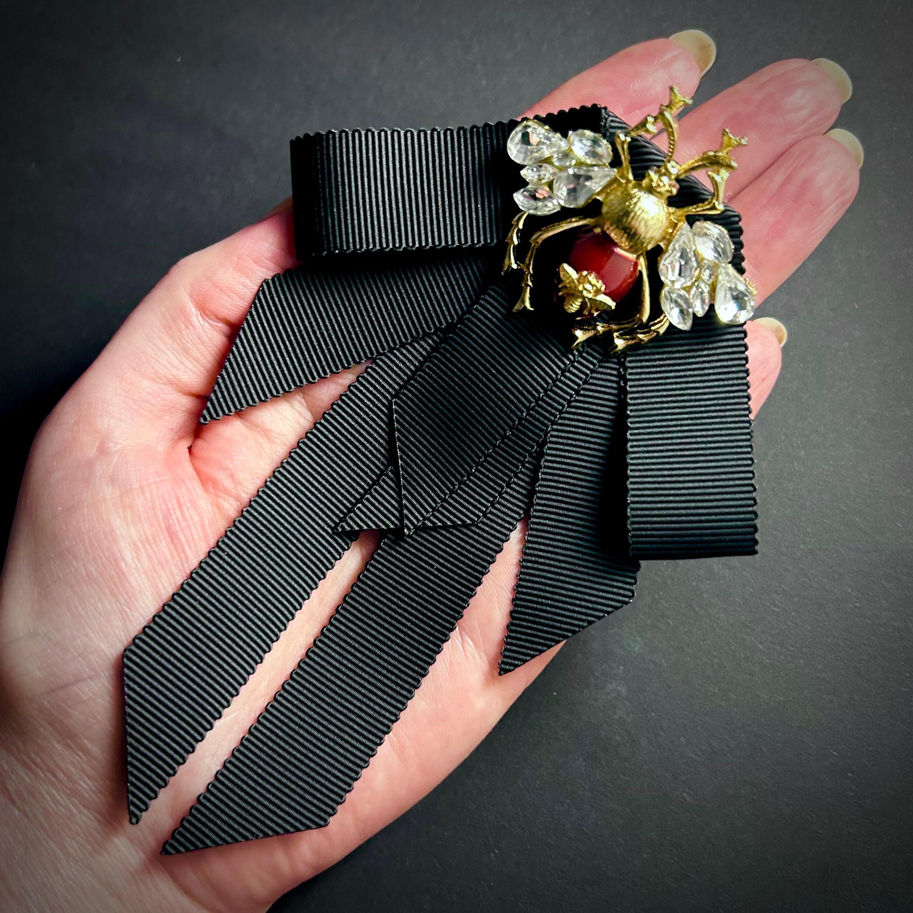 CHANEL Bow Brooch in Black Silk Satin and Camellia in Silver