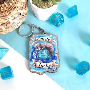 Otterly Lucky, Dungeons and Dragons dice D20 with otter and fish, wooden keychain, 2.5 inch