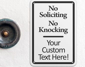 May include: White metal sign with black border and text that reads "No Soliciting No Knocking Your Custom Text Here!"  Metal Signs.