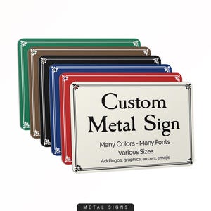 May include: A stack of rectangular metal signs in various colors, including green, brown, black, blue, and red. The front sign is cream-colored with the text "Custom Metal Sign". The signs have decorative borders and text that reads "Many Colors - Many Fonts, Various Sizes".
