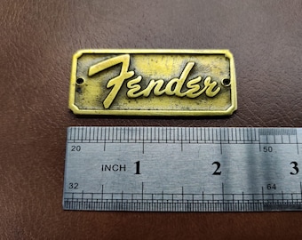 Vintage Fender 1957 hard case logo badge metallic old bronze finish