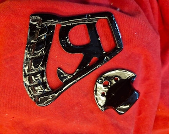 6 string black R tailpiece for guitar.