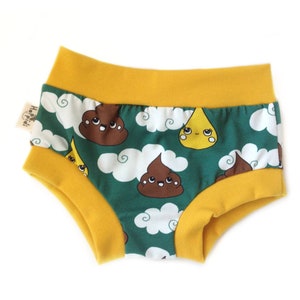 May include: Green and yellow underwear with a print of brown poop and yellow raindrops with faces. The underwear has a yellow waistband.