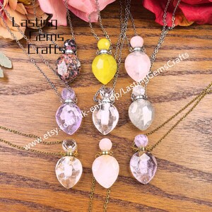May include: A collection of gemstone pendant necklaces with various colored crystal bottles. The bottles are suspended from delicate chains. The image includes the text "Lasting Gems Crafts" and a website address.