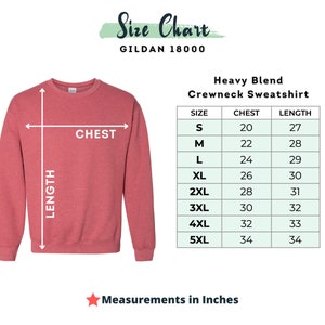May include: Size chart for a Gildan 18000 heavy blend crewneck sweatshirt. The chart shows chest and length measurements in inches for sizes S through 5XL.