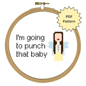 May include: A cross-stitch pattern in a wooden hoop. The text reads "I'm going to punch that baby" with a pixelated fairy illustration. A yellow starburst graphic indicates a PDF pattern.