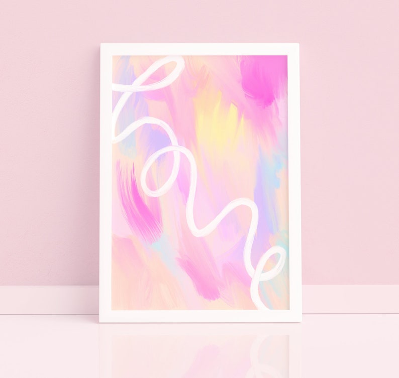May include: A framed abstract painting with a pink, yellow, and blue color scheme. The word "home" is written in white cursive across the painting.