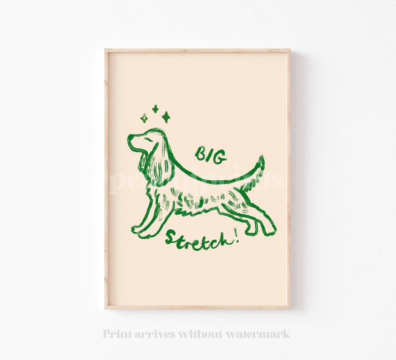 May include: A framed print featuring a green line drawing of a dog in a stretching pose. The words "BIG Stretch!" are written above and below the dog. The background is a light beige color.