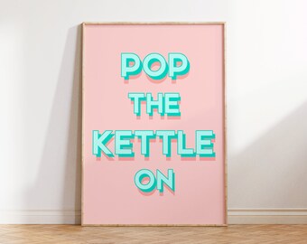 Peut inclure: Une affiche encadrée rose avec le texte "POP THE KETTLE ON" en lettres turquoise avec un effet 3D.