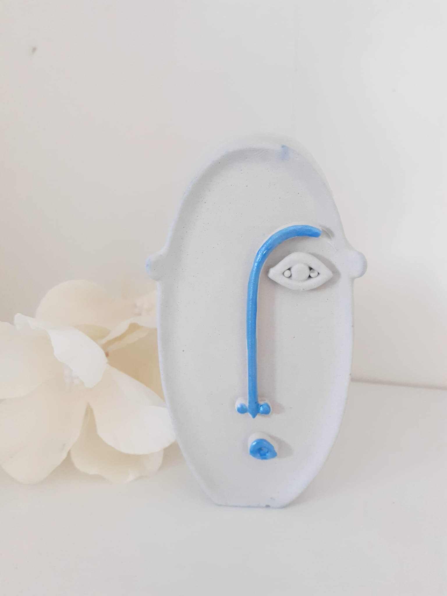 Small modern decorative face