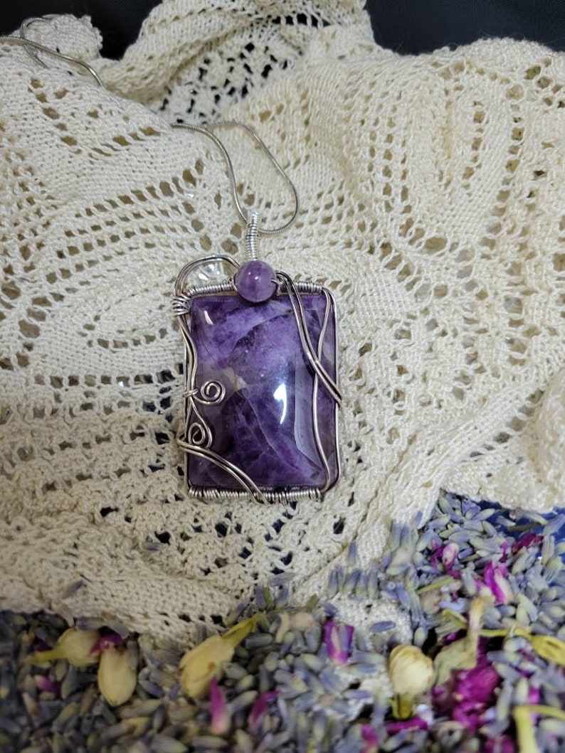 Beautiful amethyst stone wire wrapped in silver oxidized wire.