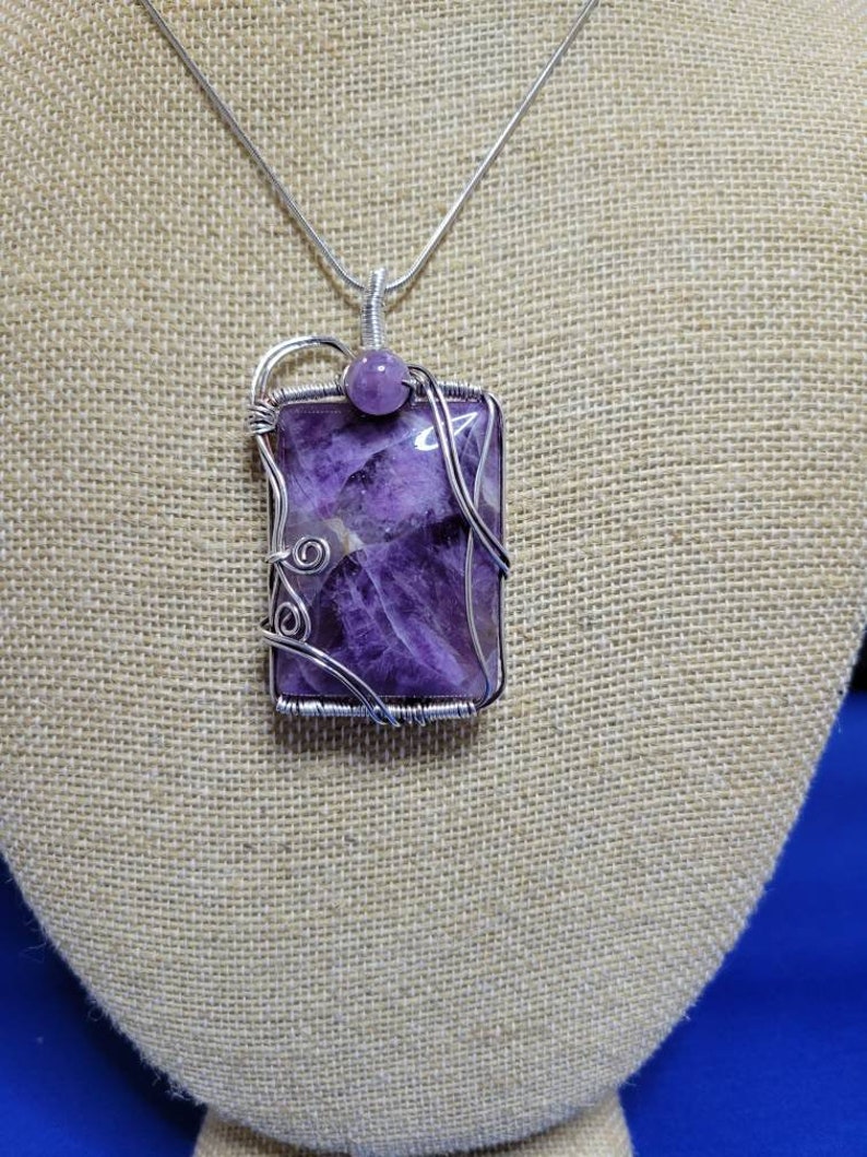 Beautiful amethyst stone wire wrapped in silver oxidized wire.