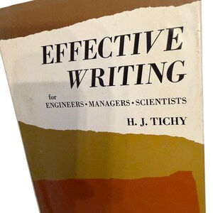 May include: A book titled Effective Writing for Engineers, Managers, Scientists by H. J. Tichy. The cover features a white central section with black text, bordered by brown and orange abstract shapes at the top and bottom edges of the book cover.