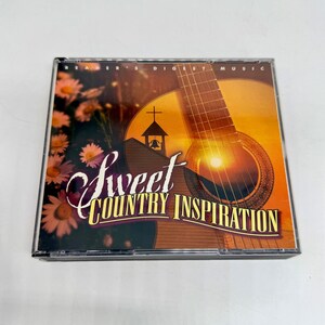 Puede incluir: Un CD de Reader's Digest Music titulado "Sweet Country Inspiration". La portada presenta una guitarra, una silueta de iglesia y detalles florales. La caja del CD es de plástico transparente.