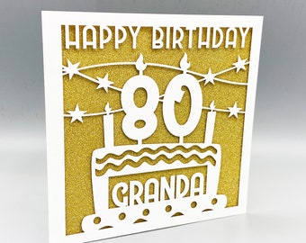 Tarjeta personalizada de 80 cumpleaños con purpurina y corte láser.