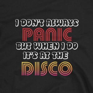 May include: Black t-shirt with a retro-style graphic that reads "I don't always panic but when I do it's at the disco".