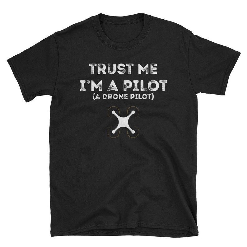 May include: Black t-shirt with the text "Trust me I'm a pilot (A drone pilot)" and a white drone icon.