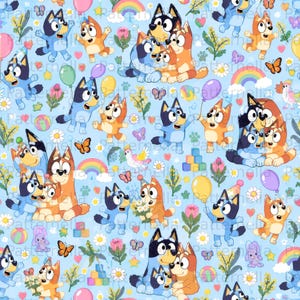 May include: A light blue fabric pattern featuring Bluey and Bingo characters, colorful balloons, rainbows, butterflies, flowers, and building blocks. The repeating design includes various poses of the blue and orange dogs.