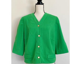 May include: A green, short-sleeved, button-up cardigan with gold buttons.