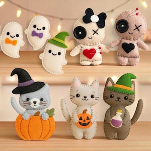 May include: A collection of felt Halloween ornaments including three white ghosts, two voodoo-style dolls with button eyes, and three cats. The cats are depicted with a witch hat in a pumpkin, holding a jack-o'-lantern, and wearing a green witch hat.