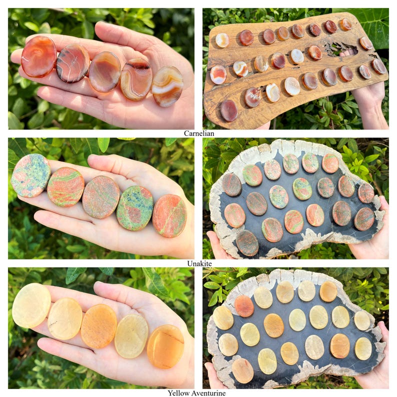 May include: Assortment of polished gemstone cabochons in various colours, including carnelian, unakite, and yellow aventurine. Each stone is displayed on a wooden surface with a grid pattern.