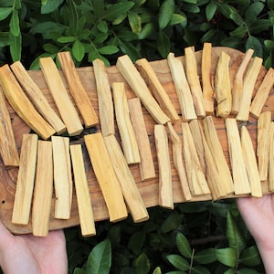 Bulk Lot of Palo Santo Wood Sticks on a display tray.