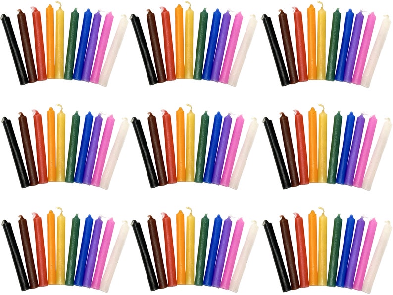 May include: A set of 36 small, thin, colored candles. The candles are arranged in rows of 12, with each row containing a different color. The colors are red, orange, yellow, green, blue, purple, pink, white, black, brown, and two shades of yellow.