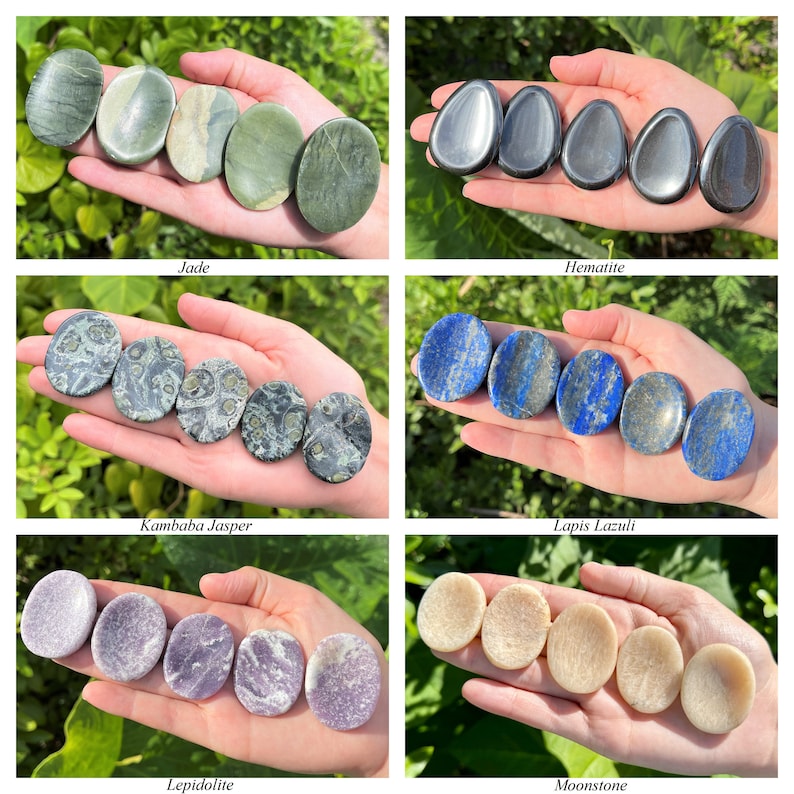 May include: A collection of six different types of palm stones, including jade, hematite, kambaaba jasper, lapis lazuli, lepidolite, and moonstone. Each stone is smooth and polished, and they are arranged in a row in the palm of a hand.