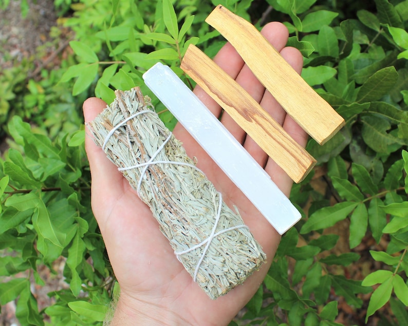 A 5" Selenite Crystal, 2 Palo Santo Sticks and a Blue Sage Smudge Stick