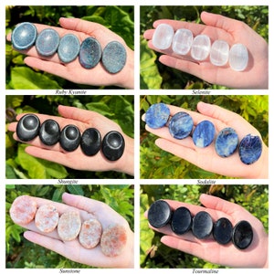 May include: Assortment of polished gemstone palm stones, including ruby kyanite, selenite, shungite, sodalite, sunstone, and tourmaline. Each stone is smooth and oval-shaped, perfect for holding in the hand or using for massage.