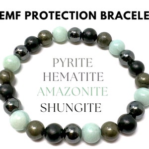 May include: A bracelet made of black, green, and gold beads. The beads are labeled as Pyrite, Hematite, Amazonite, and Shungite.