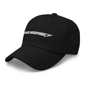 May include: A black baseball cap with a white embroidered logo that says "Stark Industries".