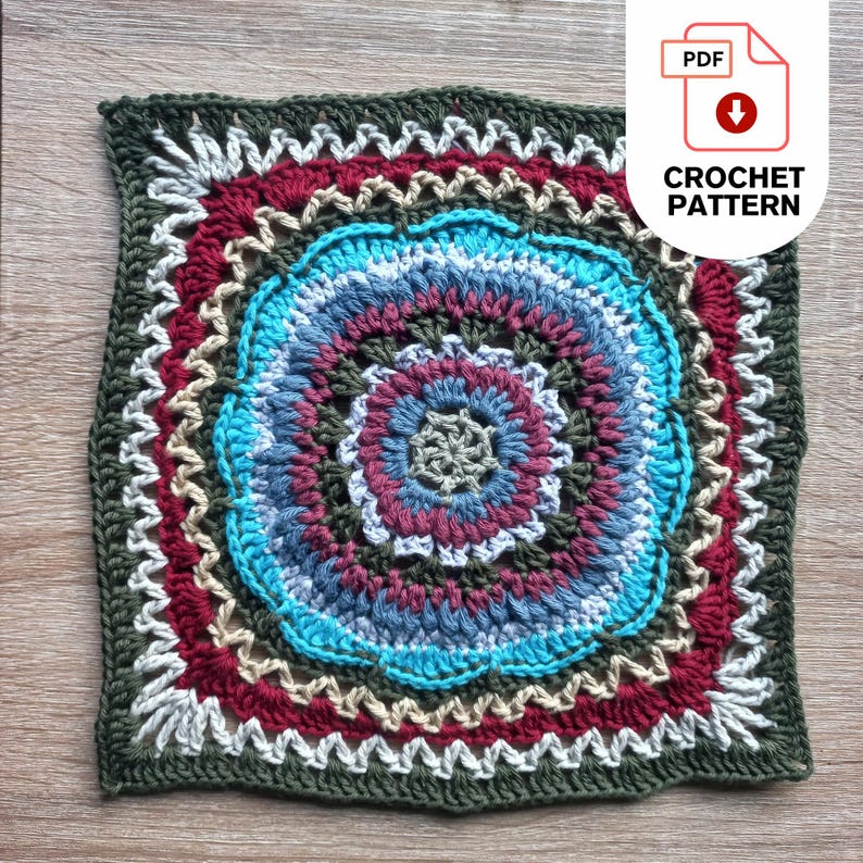A square, multi-colored african flower crochet square pattern featuring concentric puff stitch petal circles in shades of blue, red, and beige, framed by a dark green border. The design includes the text "CROCHET PATTERN" with a PDF icon, indicating a downloadable pattern.