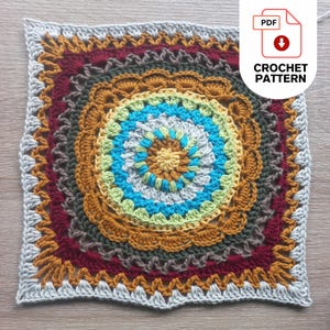 Colorful, african patchwork blanket square crochet pattern with a circular design in the center. The pattern features shades of blue, yellow, green, brown, and red. The text "CROCHET PATTERN" is displayed on a white background with a PDF icon.