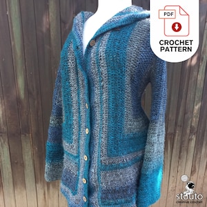 May include: A handmade crochet cardigan in shades of blue, teal, and gray, featuring a hooded design and button closure. The garment has a textured, striped pattern and is displayed on a mannequin. The image includes a "CROCHET PATTERN" graphic.