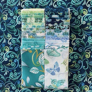 Butterfly Calypso strip-pies from Benartex, 40 - 2 1/2&quot; x 42&quot; pieces, jelly roll and 2 yards of Calypso swirl Navy