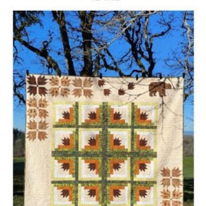 May include: A quilt pattern called "Kodiak" featuring a brown bear, paw prints, and a log cabin design in shades of brown, green, and white. The quilt is 92 inches by 92 inches.