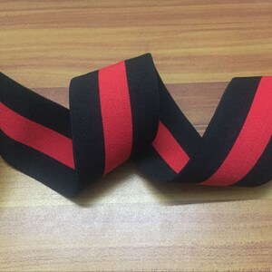 May include: Black and red striped elastic trim. The trim is made of a soft, stretchy fabric and is perfect for adding a pop of color to your sewing projects.