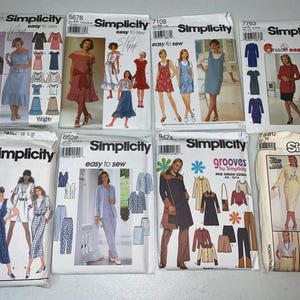May include: A collection of Simplicity sewing patterns featuring various clothing designs. The patterns include dresses, skirts, tops, pants, and jackets. The patterns are easy to sew and come with instructions.