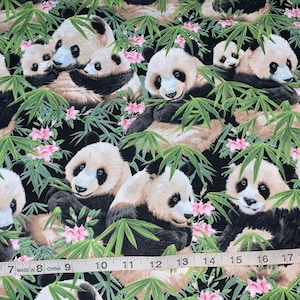 May include: A black fabric with a repeating pattern of pandas eating bamboo shoots. The pandas are surrounded by green bamboo leaves and pink flowers.