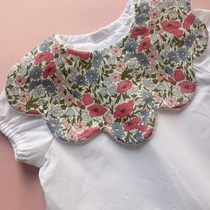 Floral themed Liberty In pink and blue and red scalloped bib, Christmas outfit bib, Liberty tana lawn cotton, personalised baby shower gift