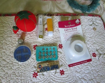 Lot of Misc Sewing Notions Tomato Pin Cushion Needles Tumble Elastic Fabric Bond New Measuring Tape Snaps